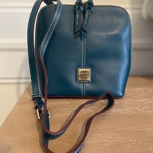 New. Never used. Dooney and Bourke Deep Teal Trixie Crossbody